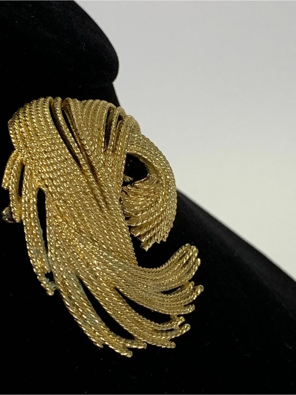 Vintage Monet Gold Tone Textured Swirl Brooch